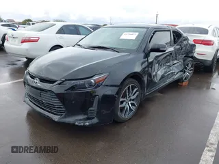 2015 Scion tC with VIN JTKJF5C79FJ003404, listed as a IAAI auction lot 41756024 with 128,906 mi miles. Bid and sale history available at carsss.com. Image 2.