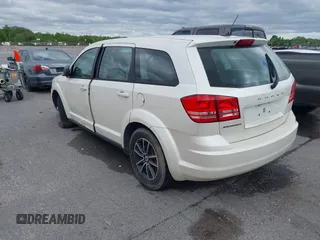 2014 Dodge Journey SE with VIN 3C4PDCAB1ET192530, listed as a IAAI auction lot 41987728 with 186,486 mi miles and . Bid and sale history available at carsss.com. Image 3.