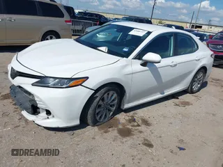 2019 Toyota Camry LE with VIN 4T1B11HK4KU180995, listed as a IAAI auction lot 42088737 with 133,813 mi miles and . Bid and sale history available at DreamBid. Image 2.