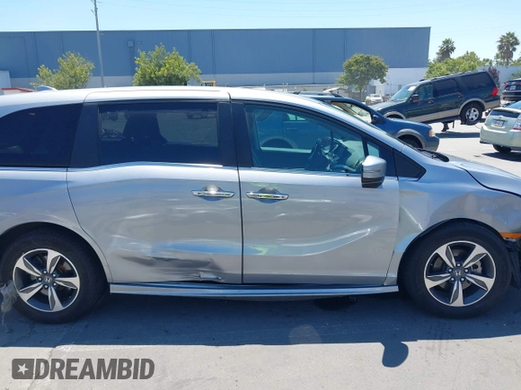2018 Honda Odyssey Touring with VIN 5FNRL6H81JB022975, listed as a IAAI auction lot 42653304 with 210,137 mi miles and . Bid and sale history available at DreamBid. Image 14.