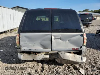 1999 GMC Denali z VIN 1GKEK13R4XR918005, wystawiony jako Copart lot #74964184 z przebiegiem 206 584 mil mil oraz Nie do naprawy. Historia ofert i sprzedaży dostępna na DreamBid. Obrazek 6.