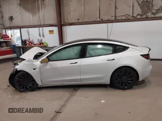 2021 Tesla Model 3 Performance with VIN 5YJ3E1ECXMF991836, listed as a IAAI auction lot 41830519 with Not Provided miles and . Bid and sale history available at carsss.com. Image 14.
