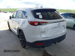 2016 Mazda CX-9 Grand Touring with VIN JM3TCADYXG0113563, listed as a IAAI auction lot 42593120 with 237,696 mi miles and . Bid and sale history available at DreamBid. Image 3.