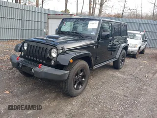 2015 Jeep Wrangler Unlimited Sahara with VIN 1C4HJWEG0FL661723, listed as a IAAI auction lot 41998393 with 89,077 mi miles. Bid and sale history available at carsss.com. Image 2.