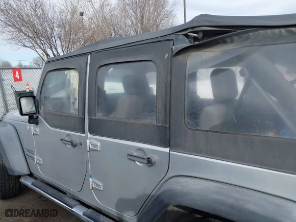2010 Jeep Wrangler Unlimited Sport with VIN 1J4BA3H10AL112599, listed as a IAAI auction lot 41739263 with 156,301 mi miles. Bid and sale history available at carsss.com. Image 14.