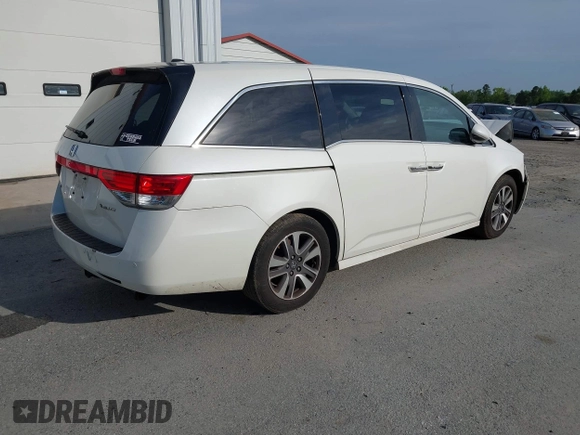 2014 Honda Odyssey Touring with VIN 5FNRL5H94EB001479, listed as a IAAI auction lot 41123678 with 147,269 mi miles and . Bid and sale history available at carsss.com. Image 4.