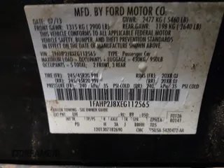 2014 Ford Taurus Limited z VIN 1FAHP2J8XEG112565, wystawiony jako IAAI lot #41554413 z przebiegiem 180 870 mil mil oraz . Historia ofert i sprzedaży dostępna na DreamBid. Obrazek 9.