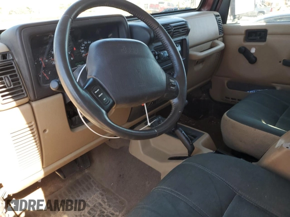 2002 Jeep Wrangler Sahara with VIN 1J4FA59S12P704608, listed as a Copart auction lot 69146504 with 125,920 mi miles and Salvage Title. Bid and sale history available at carsss.com. Image 8.