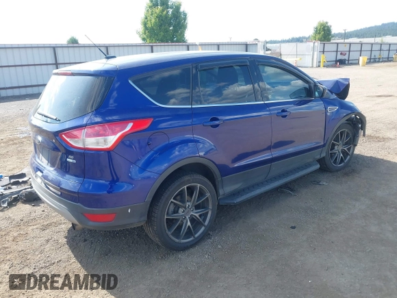 2013 Ford Escape SE with VIN 1FMCU9GXXDUB70983, listed as a IAAI auction lot 42432050 with 97,515 mi miles and . Bid and sale history available at DreamBid. Image 4.