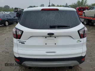 2018 Ford Escape SE z VIN 1FMCU9GD2JUA76985, wystawiony jako Copart lot #55743855 z przebiegiem 84 549 mil mil oraz Szkody całkowita. Historia ofert i sprzedaży dostępna na DreamBid. Obrazek 6.