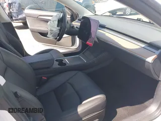 2023 Tesla Model 3 with VIN 5YJ3E1EA0PF621448, listed as a IAAI auction lot 42500155 with 26,589 mi miles and . Bid and sale history available at DreamBid. Image 5.