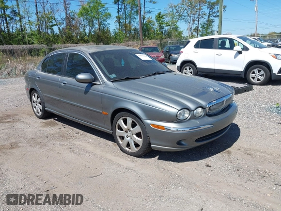 2004 Jaguar X-Type with VIN SAJEA51C04WD73023, listed as a IAAI auction lot 41874488 with 199,333 mi miles and . Bid and sale history available at DreamBid. Image 1.