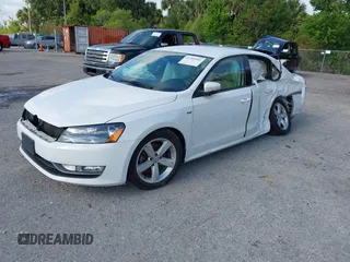2015 Volkswagen Passat 1.8T Limited Edition with VIN 1VWAT7A3XFC100852, listed as a IAAI auction lot 41204902 with 85,725 mi miles. Bid and sale history available at carsss.com. Image 2.