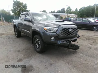 2021 Toyota Tacoma SR z VIN 3TYCZ5AN7MT017377, wystawiony jako IAAI lot #42285326 z przebiegiem 91 657 mil mil oraz . Historia ofert i sprzedaży dostępna na DreamBid. Obrazek 1.