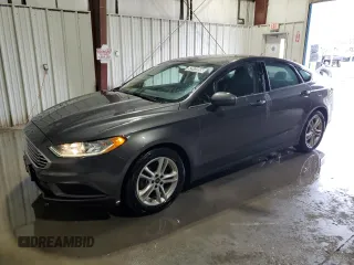2018 Ford Fusion SE z VIN 3FA6P0H79JR111709, wystawiony jako Copart lot #52972855 z przebiegiem 116 442 mil mil oraz Czysty tytuł • Clean title. Historia ofert i sprzedaży dostępna na DreamBid. Obrazek 1.
