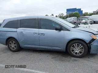 2012 Honda Odyssey EX-L with VIN 5FNRL5H66CB061847, listed as a IAAI auction lot 42162377 with 217,204 mi miles and . Bid and sale history available at DreamBid. Image 13.