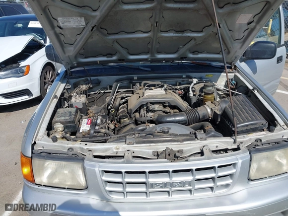 1998 Isuzu Rodeo S with VIN 4S2CM58WXW4325350, listed as a IAAI auction lot 42084411 with 292,784 mi miles. Bid and sale history available at carsss.com. Image 10.