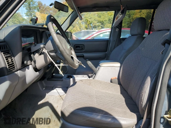 1998 Jeep Cherokee Sport with VIN 1J4FT68S4WL121559, listed as a Copart auction lot 77387794 with 163,453 mi miles and Salvage Title. Bid and sale history available at carsss.com. Image 7.