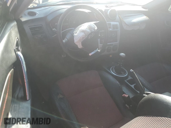 2005 Hyundai Tiburon GT z VIN KMHHN65F85U158764, wystawiony jako Copart lot #80060884 z przebiegiem 121 747 mil mil oraz Czysty tytuł • Clean title. Historia ofert i sprzedaży dostępna na DreamBid. Obrazek 8.