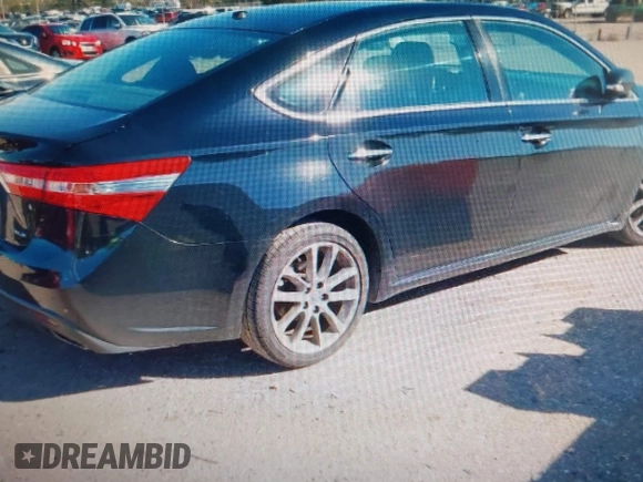 2014 Toyota Avalon Limited with VIN 4T1BK1EB4EU096164, listed as a IAAI auction lot 40904808 with 242,086 mi miles. Bid and sale history available at carsss.com. Image 4.
