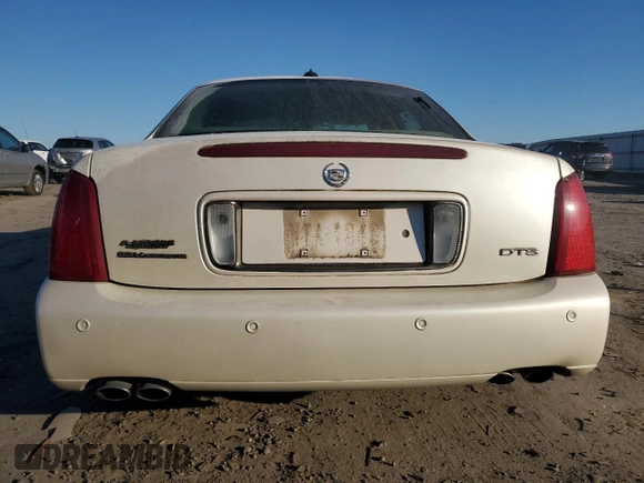 2003 Cadillac DeVille DTS z VIN 1G6KF57963U257494, wystawiony jako Copart lot #84532944 z przebiegiem 104 766 mil mil oraz Szkoda całkowita • Salvage title. Historia ofert i sprzedaży dostępna na DreamBid. Obrazek 6.