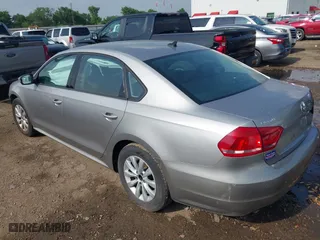 2014 Volkswagen Passat Wolfsburg Ed with VIN 1VWAT7A38EC089882, listed as a IAAI auction lot 41945624 with 130,162 mi miles. Bid and sale history available at carsss.com. Image 3.