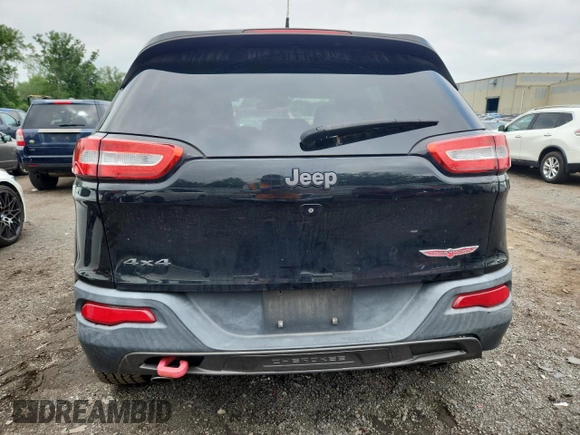 2014 Jeep Cherokee Trailhawk with VIN 1C4PJMBS3EW127928, listed as a Copart auction lot 63825865 with 172,712 mi miles and Salvage title. Bid and sale history available at DreamBid. Image 6.