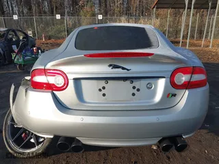 2014 Jaguar XK with VIN SAJWA4DC7EMB52199, listed as a IAAI auction lot 41191119 with 90,585 mi miles. Bid and sale history available at carsss.com. Image 16.