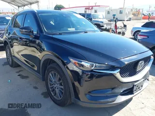 2019 Mazda CX-5 Sport with VIN JM3KFABM7K1579747, listed as a IAAI auction lot 41965097 with 151,042 mi miles and . Bid and sale history available at DreamBid. Image 1.