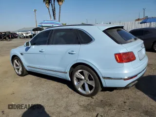 2019 Bentley Bentayga V8 z VIN SJAAM2ZV9KC026988, wystawiony jako Copart lot #73576964 z przebiegiem 31 162 mil mil oraz Szkoda całkowita • Salvage title. Historia ofert i sprzedaży dostępna na DreamBid. Obrazek 2.