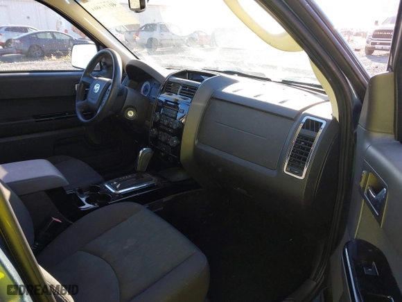 2010 Mazda Tribute Touring with VIN 4F2CY9C73AKM04595, listed as a IAAI auction lot 40797681 with 122,774 mi miles. Bid and sale history available at carsss.com. Image 5.