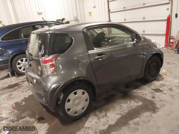 2012 Scion iQ with VIN JTNJJXB03CJ019403, listed as a IAAI auction lot 41543384 with 110,749 mi miles. Bid and sale history available at carsss.com. Image 4.