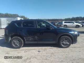2020 Mazda CX-5 Touring with VIN JM3KFACM1L1817303, listed as a IAAI auction lot 41627859 with 57,268 mi miles. Bid and sale history available at carsss.com. Image 13.