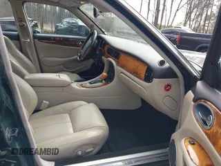 2003 Jaguar XJ with VIN SAJDA15B53MF53212, listed as a IAAI auction lot 41613266 with 180,165 mi miles and . Bid and sale history available at DreamBid. Image 5.