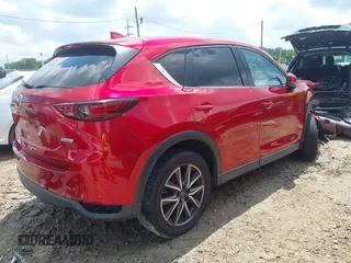 2018 Mazda CX-5 Grand Touring with VIN JM3KFADM4J0335913, listed as a IAAI auction lot 42326044 with 104,583 mi miles and . Bid and sale history available at DreamBid. Image 4.