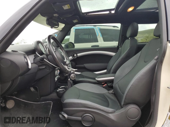 2007 MINI Hardtop with VIN WMWMF33567TT56922, listed as a Copart auction lot 56598665 with 66,605 mi miles and Salvage title. Bid and sale history available at DreamBid. Image 7.