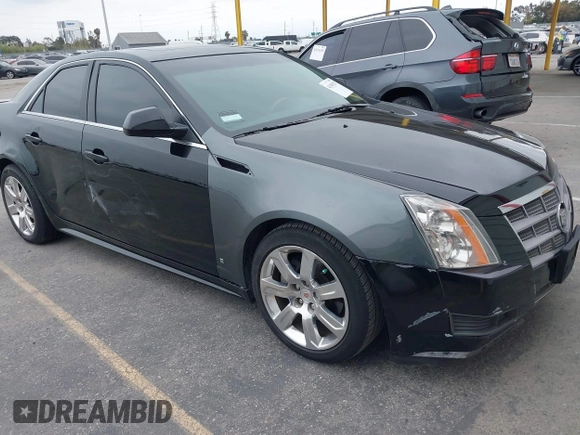 2011 Cadillac CTS Luxury with VIN 1G6DF5EYXB0103430, listed as a IAAI auction lot 42105337 with 205,069 mi miles and . Bid and sale history available at DreamBid. Image 1.