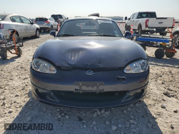 2002 Mazda MX-5 Miata Cloth z VIN JM1NB353720231873, wystawiony jako Copart lot #52398015 z przebiegiem 90 077 mil mil oraz Szkoda całkowita • Salvage title. Historia ofert i sprzedaży dostępna na DreamBid. Obrazek 5.