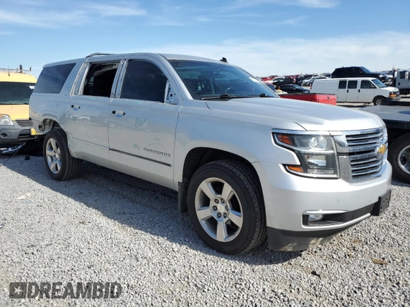2015 Chevrolet Suburban LTZ with VIN 1GNSKKKC1FR120164, listed as a Copart auction lot 53700455 with 195,815 mi miles and Salvage Title. Bid and sale history available at DreamBid. Image 4.