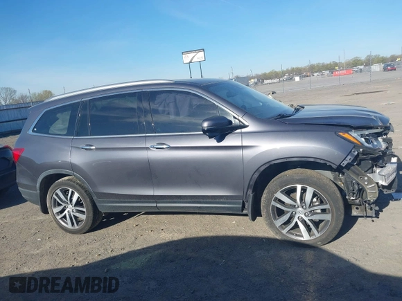 2017 Honda Pilot Touring with VIN 5FNYF5H97HB023919, listed as a IAAI auction lot 41864959 with 70,360 mi miles. Bid and sale history available at carsss.com. Image 13.