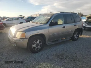 2002 GMC Envoy SLT with VIN 1GKDS13S922287249, listed as a Copart auction lot 88049875 with 157,485 mi miles and Salvage Title. Bid and sale history available at carsss.com. Image 1.