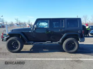 2010 Jeep Wrangler Unlimited Sahara with VIN 1J4HA5H16AL215659, listed as a IAAI auction lot 41749218 with 55,544 mi miles. Bid and sale history available at carsss.com. Image 14.