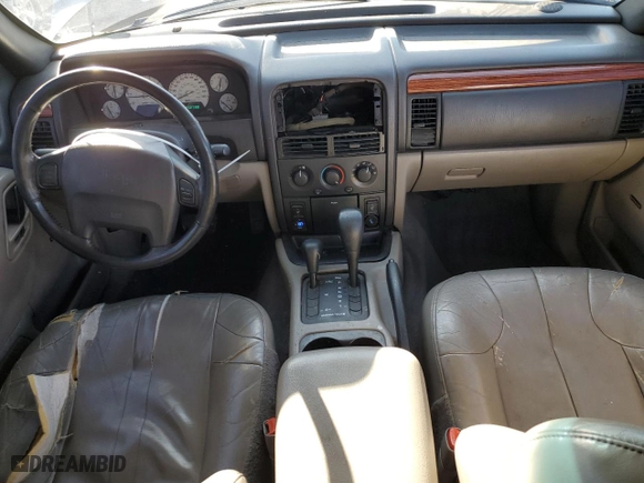 1999 Jeep Grand Cherokee Laredo with VIN 1J4GW58N9XC633464, listed as a Copart auction lot 84682454 with 212,738 mi miles and Salvage Title. Bid and sale history available at carsss.com. Image 8.