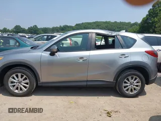2014 Mazda CX-5 Sport with VIN JM3KE4BE9E0411177, listed as a IAAI auction lot 42411938 with 167,709 mi miles and . Bid and sale history available at DreamBid. Image 14.