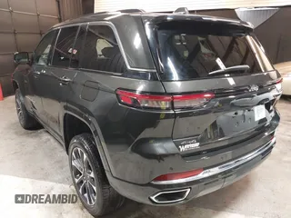 2023 Jeep Grand Cherokee Overland with VIN 1C4RJHDG0P8701157, listed as a IAAI auction lot 42080201 with 24,709 mi miles and . Bid and sale history available at DreamBid. Image 3.