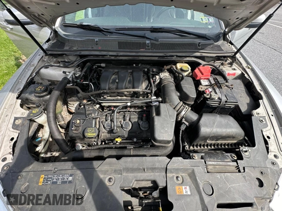 2013 Ford Taurus SEL with VIN 1FAHP2E85DG199414, listed as a Copart auction lot 54572685 with 122,416 mi miles and Clean Title. Bid and sale history available at carsss.com. Image 7.