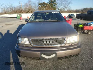 1995 Audi A6 z VIN WAUGA84A2SN055887, wystawiony jako Copart lot #85212394 z przebiegiem 254 307 mil mil oraz Tytuł czysty. Historia ofert i sprzedaży dostępna na DreamBid. Obrazek 5.