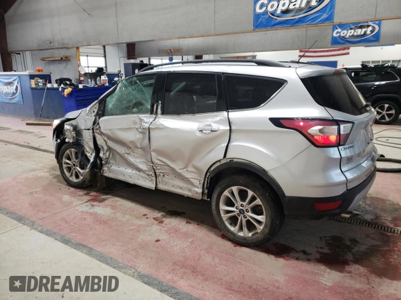 2018 Ford Escape SE with VIN 1FMCU9GD7JUA25403, listed as a Copart auction lot 87158814 with 121,281 mi miles and Salvage Title. Bid and sale history available at carsss.com. Image 2.