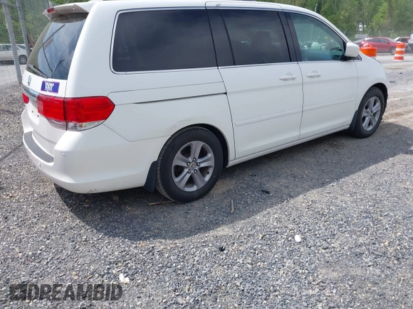 2010 Honda Odyssey Touring с VIN 5FNRL3H90AB039449, выставлен на аукционе IAAI как лот 42032203 с пробегом 128 265 миль миль и . История ставок и продаж доступна на DreamBid. Изображение 4.