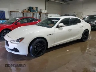 2014 Maserati Ghibli z VIN ZAM57XSA7E1081981, wystawiony jako Copart lot #52329185 z przebiegiem 42 968 mil mil oraz Szkody całkowita. Historia ofert i sprzedaży dostępna na DreamBid. Obrazek 1.